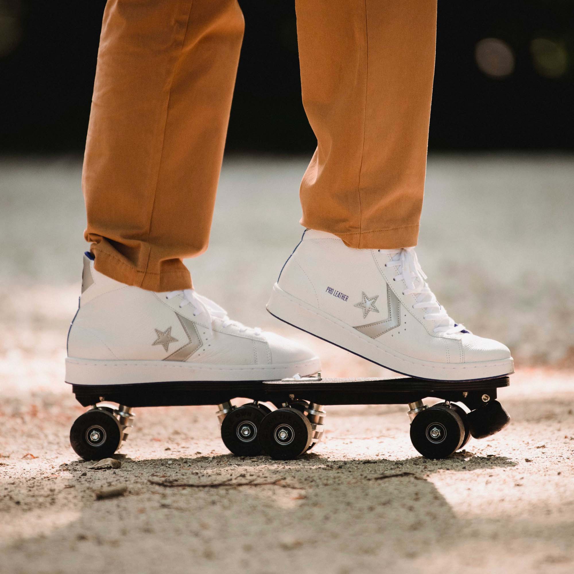 The Converse Pro Reflective White Silver detachable roller skates are being clipped-on