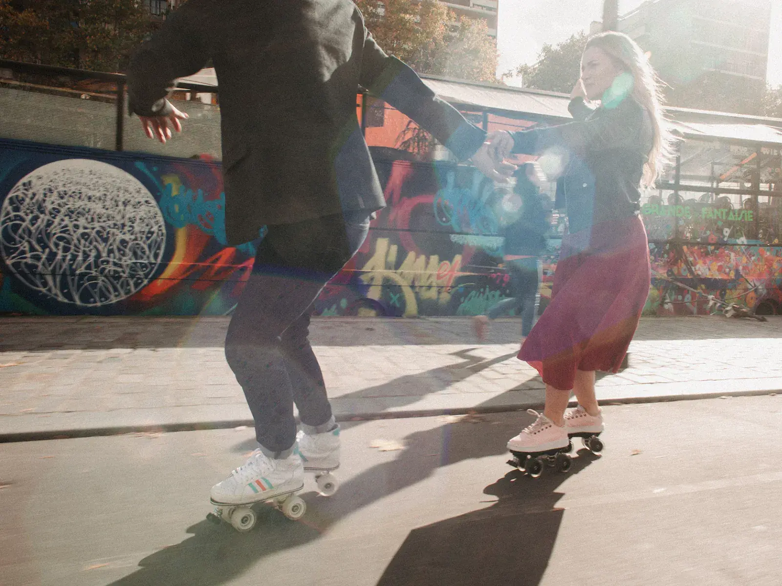 a man and a woman skating together