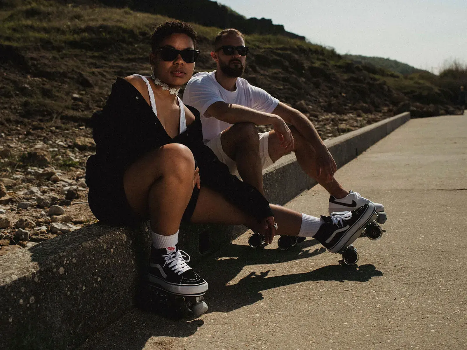 a man and woman showing their skating sneakers vans and nike transformed by flaneurz