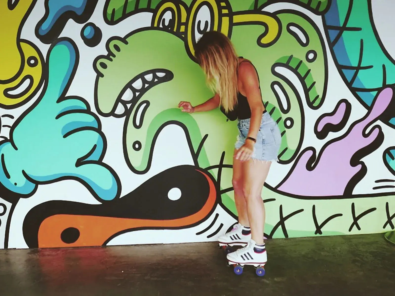 a girl is skating with her adidas transformed by flaneurz