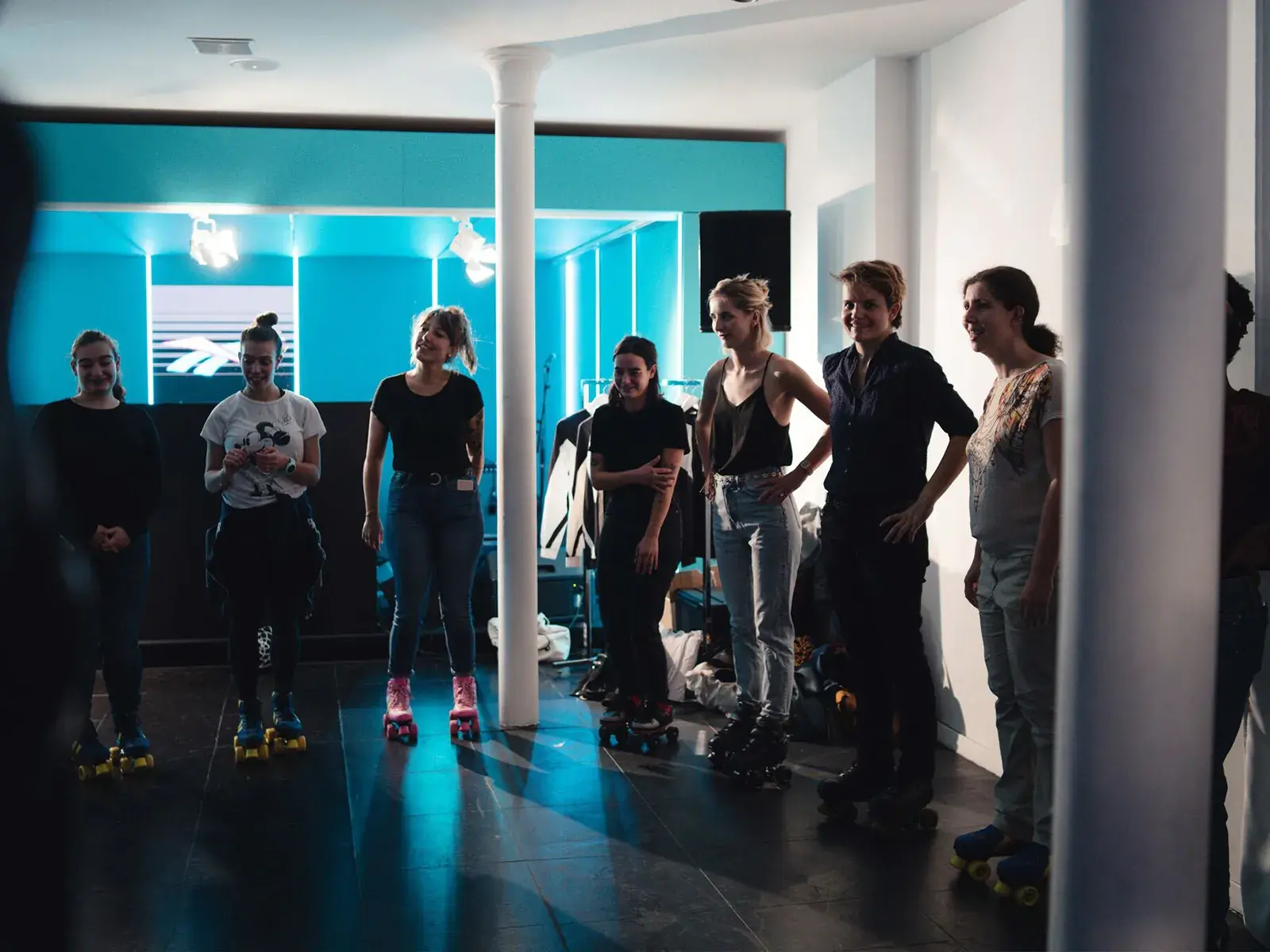 a group of women wearing roller skates 