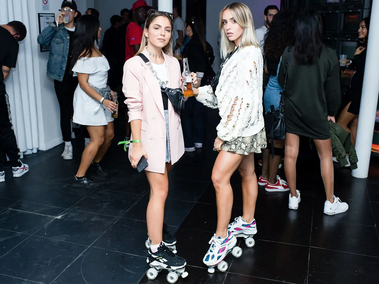 2 women wearing roller skates sneakers tranformed by flaneurz 