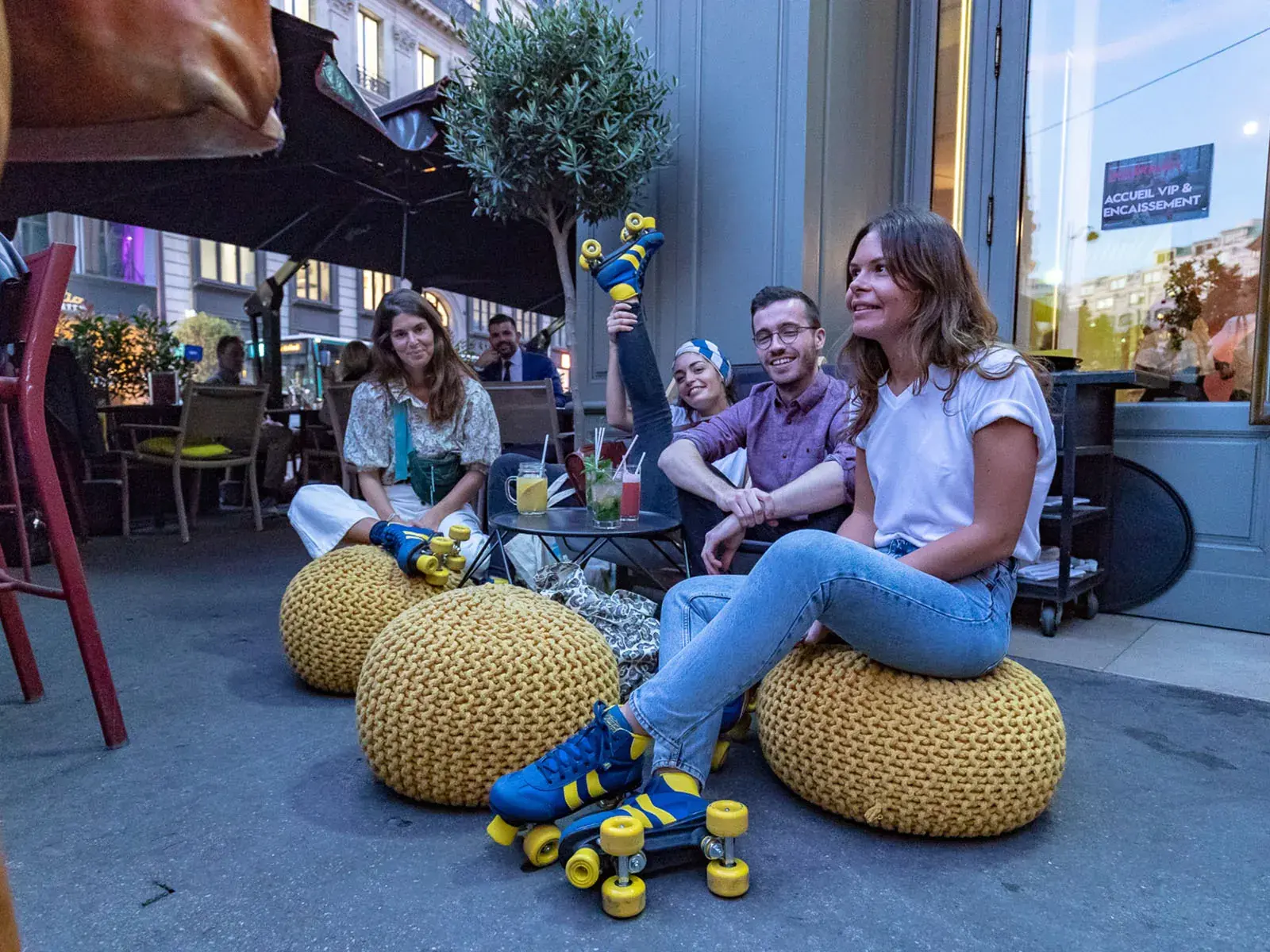a gorup of people sitting in a coffee shop wearing skating sneakers transformed by flaneurz 