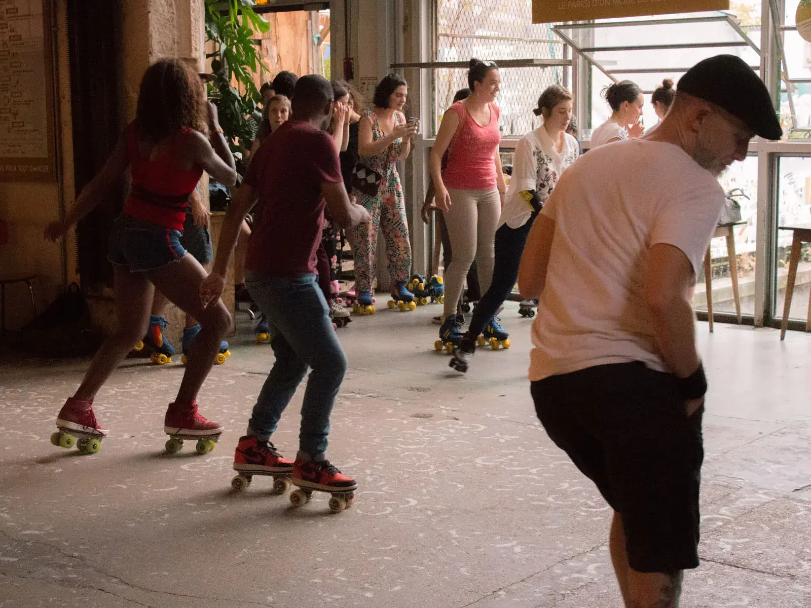 group of people wearing roller skates and skating together 4