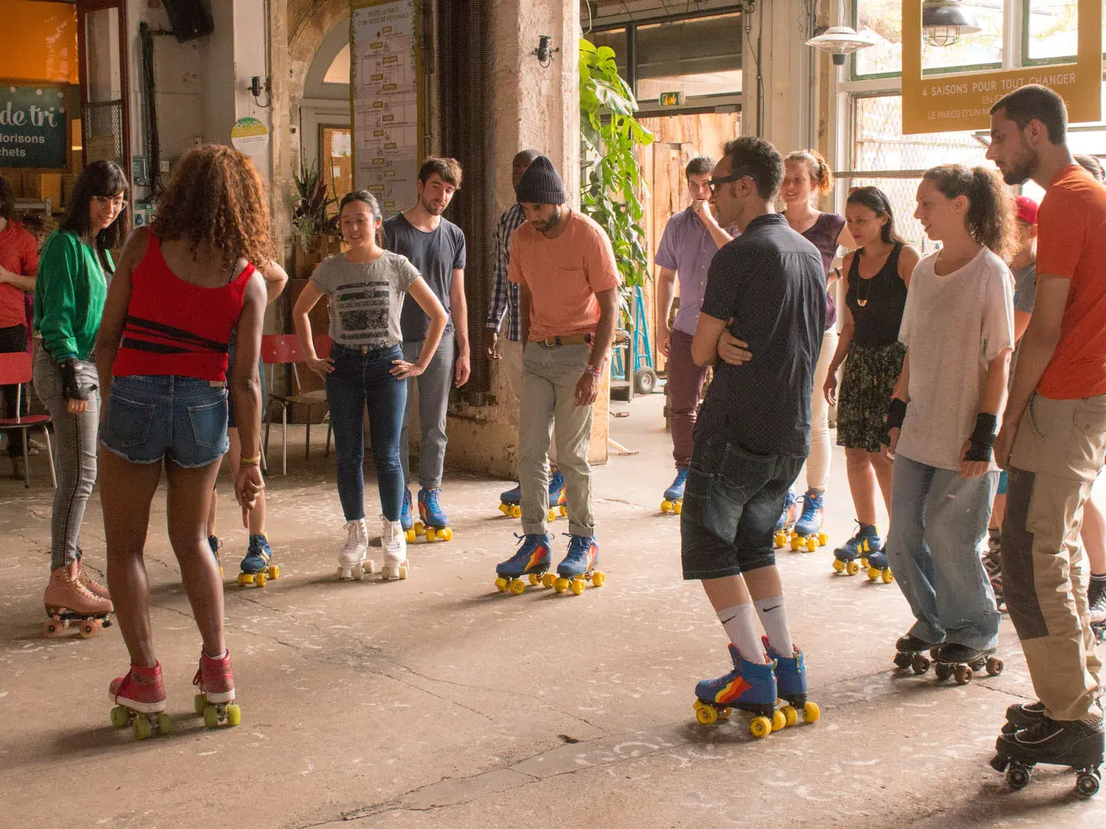 group of people wearing roller skates and skating together 2