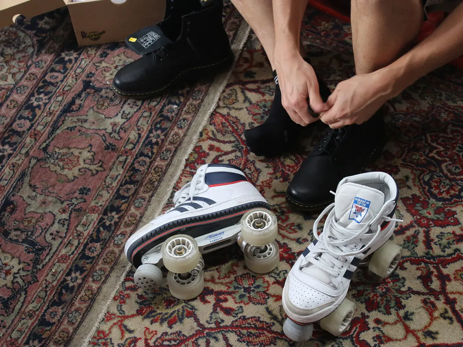 a man trying a roller skate adidas by flaneurz