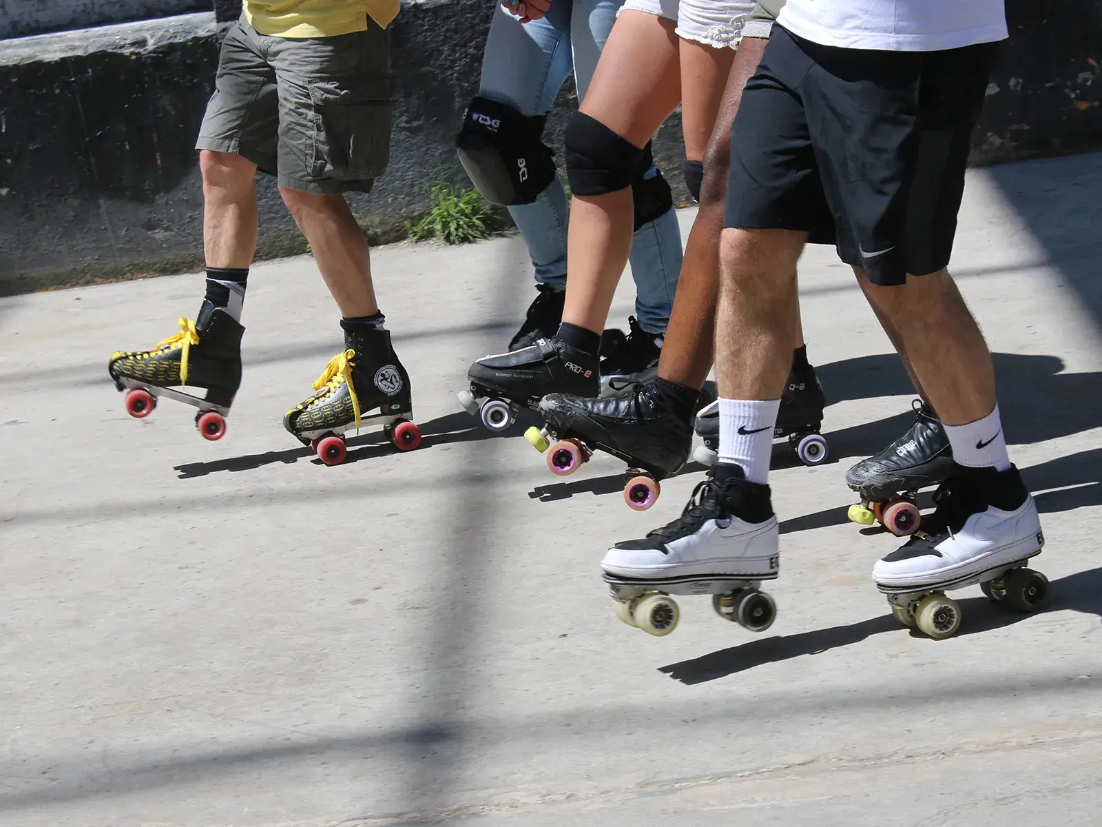 a group of people skating in the street with their roller skates by flaneurz