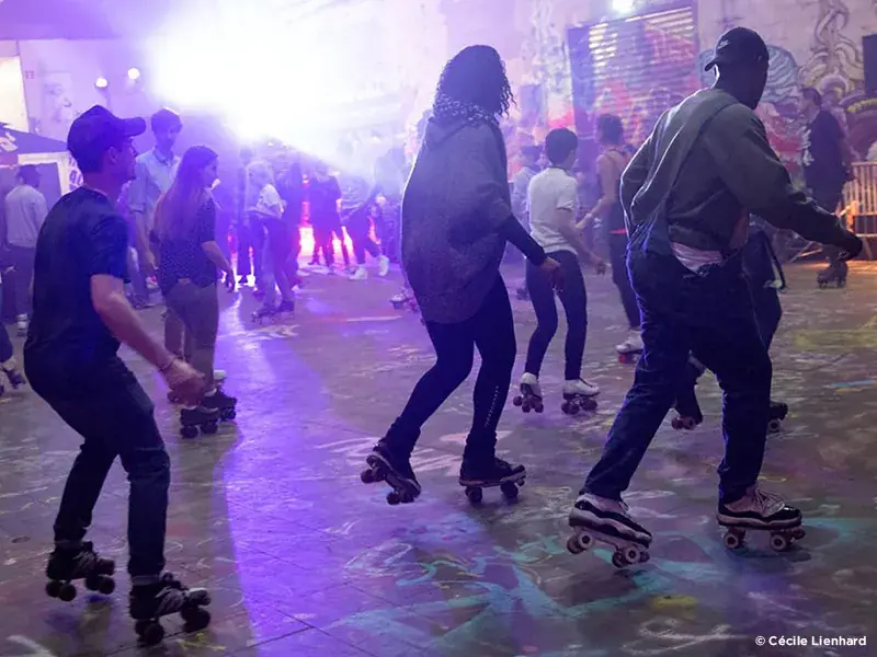 roller party by flaneurz with people dancing around and skating 