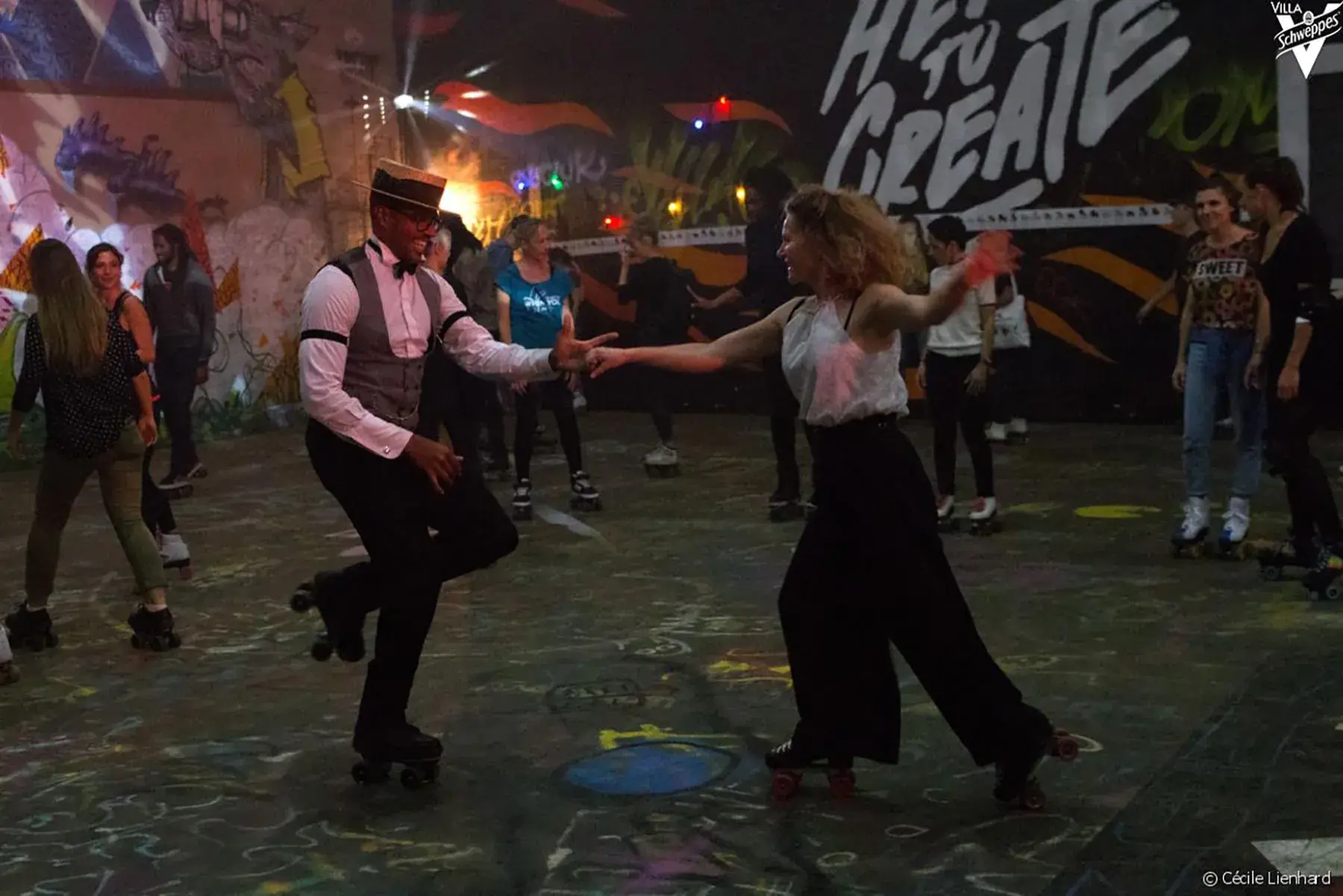 a man and a woman dancing and skating together in workshop of flaneurz 