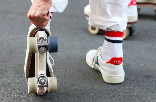 a man wearing his rolling part and attaching it to his veja transformed by flaneurz 