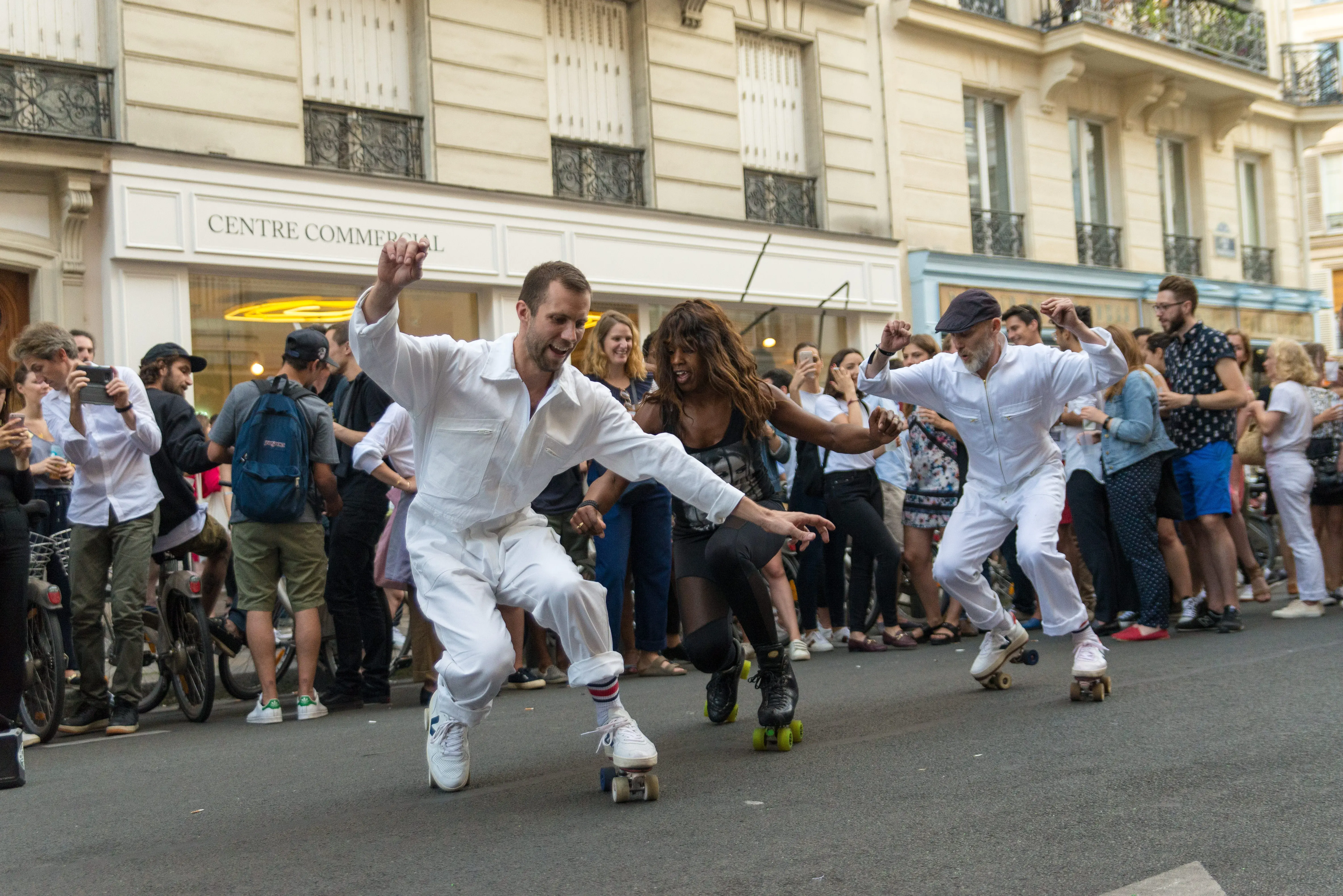 people enjoying skating in the street 