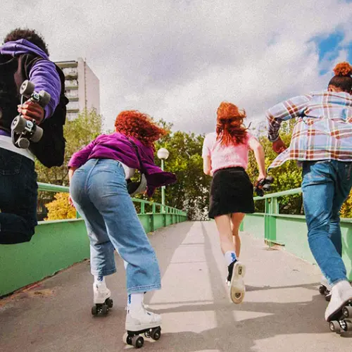 Roller-Skates-s-quad-Slades-by-Flaneurz A group of people roller skate under the sun