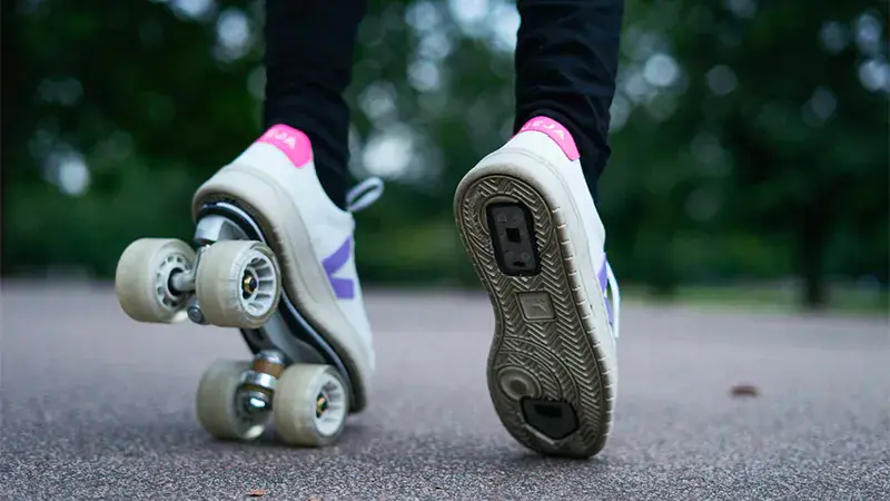 a person wearing veja sneakers with the system of flaneurz and premium rolling part