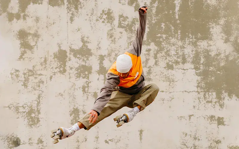 a man jumping with his roller skates