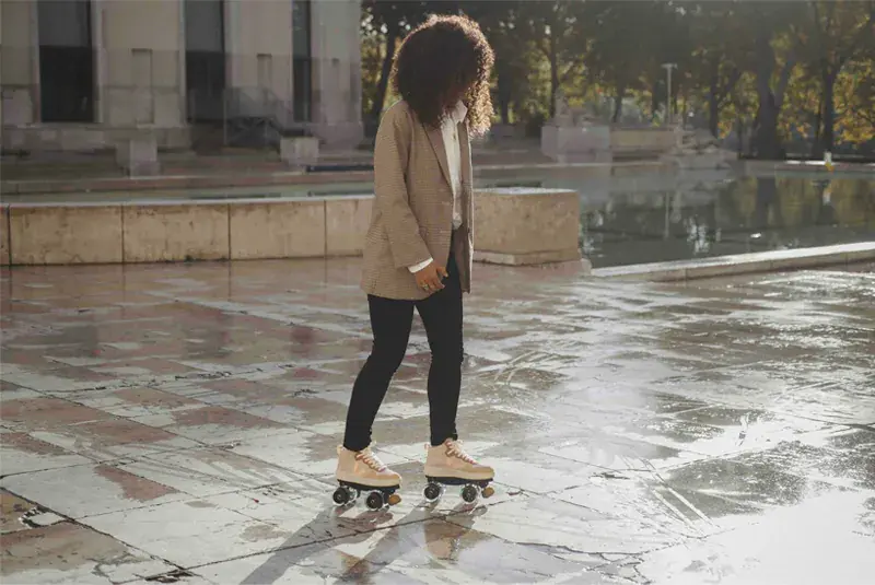 a woman rolling during the winter in the wet ground