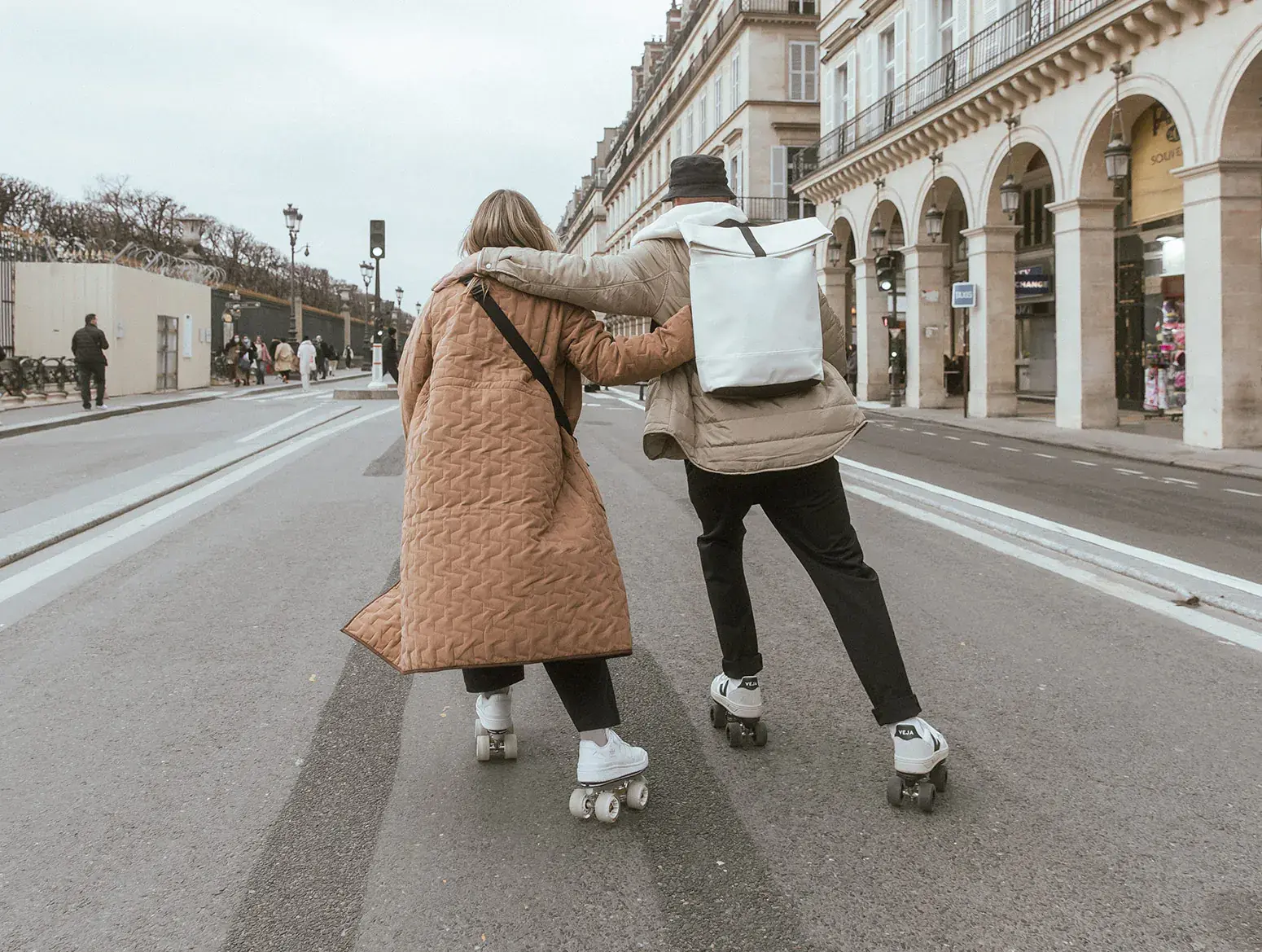 a man and a woman skating in the city